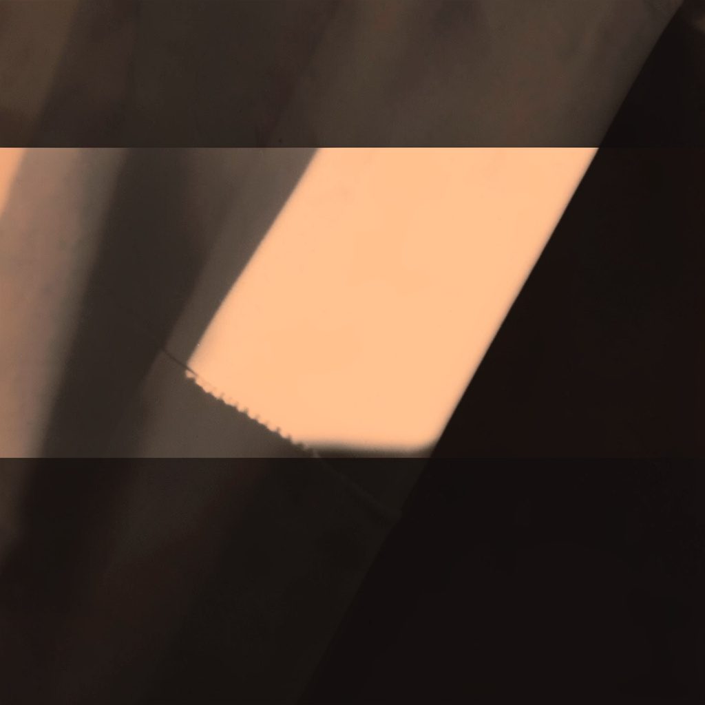 A dark duotone photograph of stadium floodlights piercing through evening haze, rendered in deep brown and warm amber.
